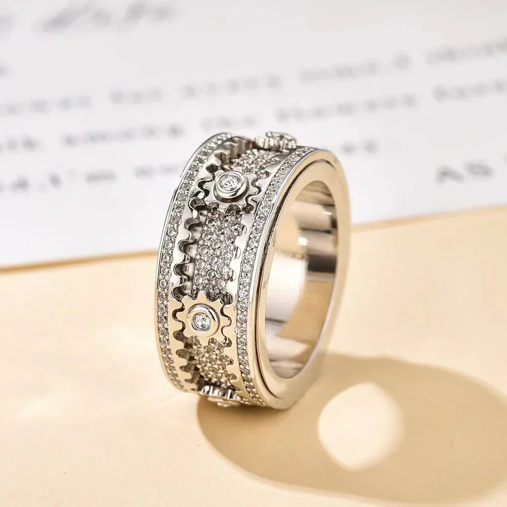 Paar-Entspannungsring – Vollständig mit Diamanten besetztes, drehbares Zahnrad-Design